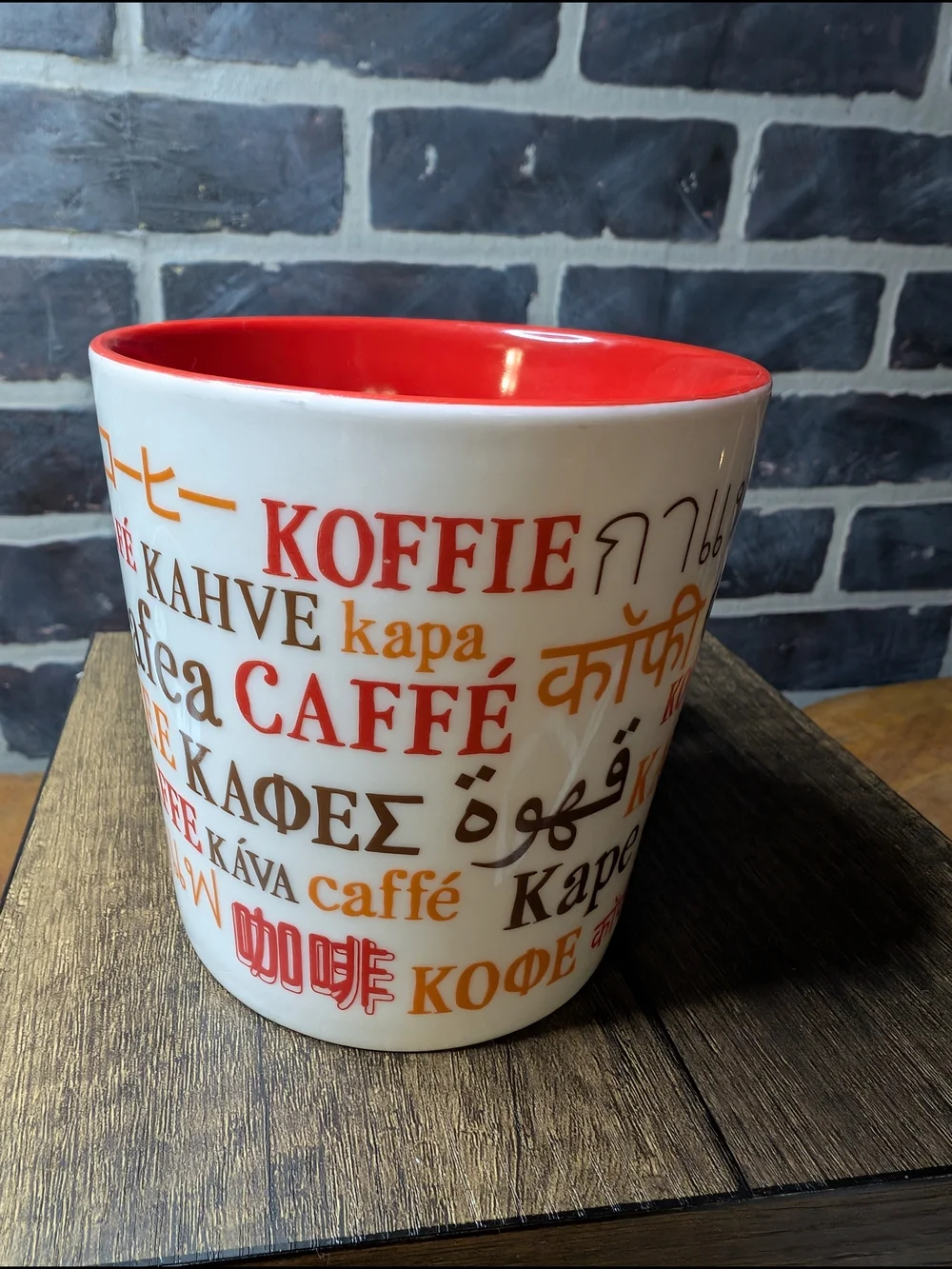 White and Red Coffee Mug with Multilingual 'Coffee' Design